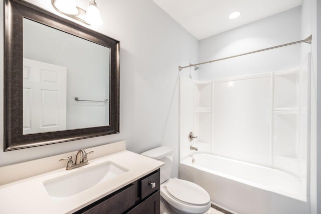 bathroom featuring toilet, vanity,  shower combination, and recessed lighting