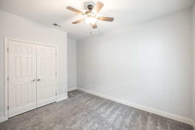 unfurnished bedroom featuring baseboards, visible vents, a closet, and carpet flooring