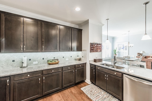 kitchen with dishwasher, light stone countertops, dark brown cabinets, a sink, and light wood-style floors
