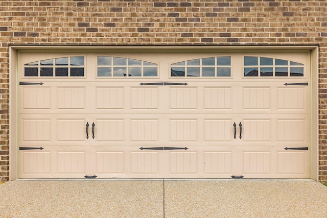 garage with concrete driveway