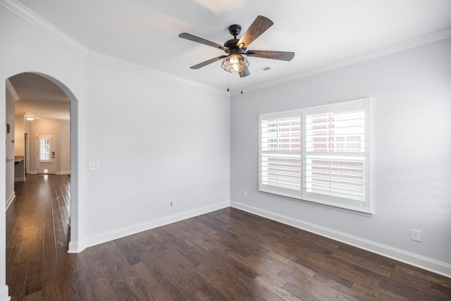 unfurnished room featuring ornamental molding, baseboards, arched walkways, dark wood-style floors, and a ceiling fan