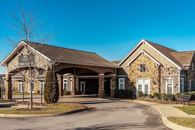 view of property featuring aphalt driveway