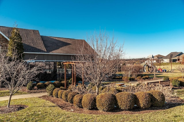 exterior space with roof with shingles