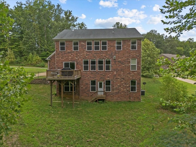 rear view of house with brick siding and a lawn