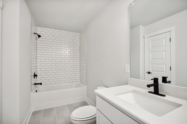 bathroom with baseboards, toilet, vanity, tile patterned flooring, and shower / bathtub combination