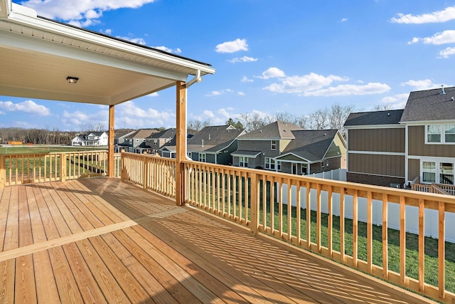 wooden deck featuring a residential view