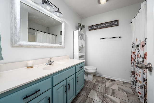 full bathroom featuring visible vents, toilet, and vanity