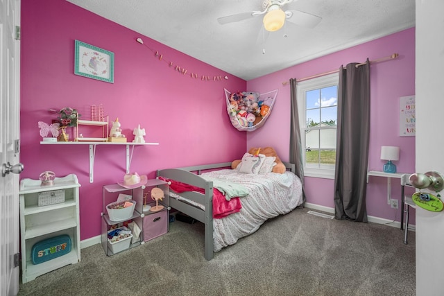 bedroom with baseboards, carpet flooring, and a ceiling fan