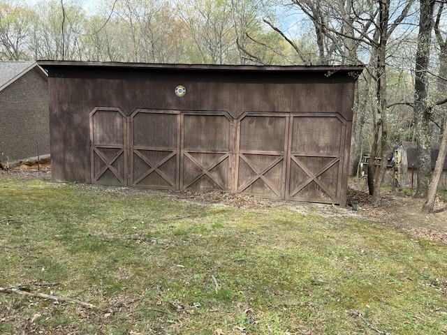 view of outbuilding featuring an outbuilding and a garage