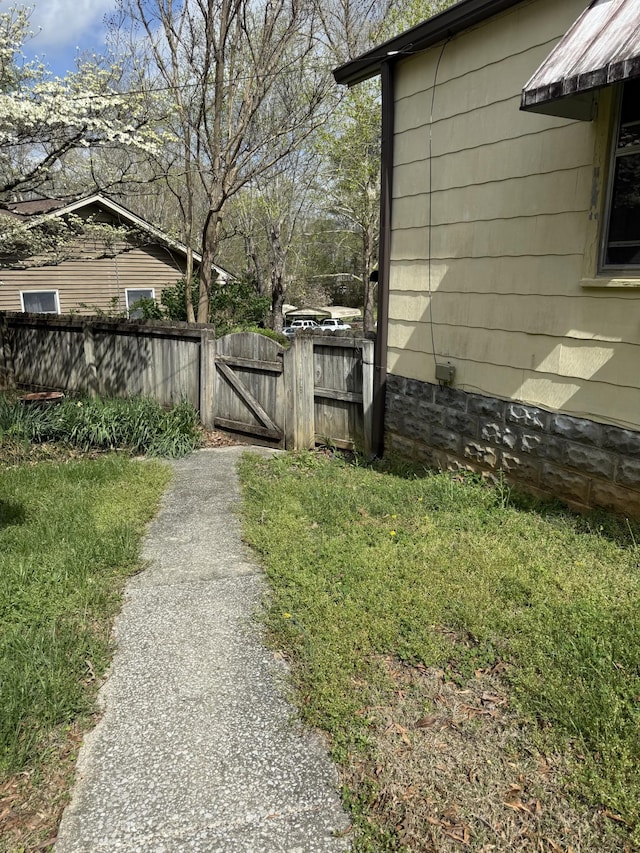 view of yard with a gate and fence