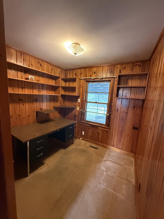 office area with visible vents and wooden walls