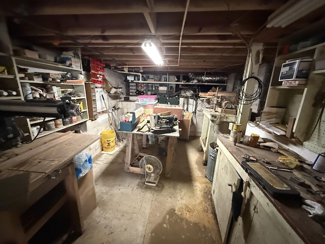 unfinished below grade area with a workshop area