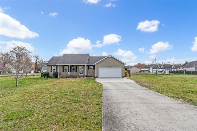 ranch-style home with driveway, a garage, and a front lawn