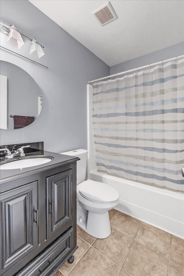 bathroom with a textured ceiling, visible vents, toilet, vanity, and shower / bath combination with curtain