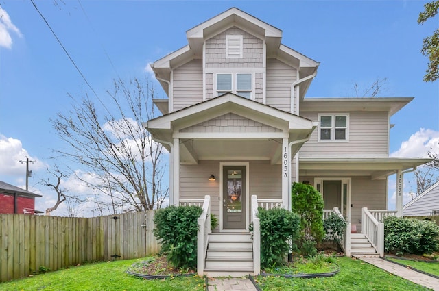 1603A 9th Ave N, Nashville, TN 37208 - view of front of home with a front lawn, covered porch, and fence