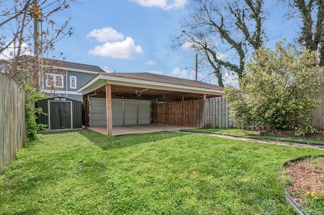 1603A 9th Ave N, Nashville, TN 37208 - view of yard featuring fence private yard, an outbuilding, a shed, and a detached garage