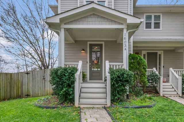 1603A 9th Ave N, Nashville, TN 37208 - view of exterior entry with a yard, a porch, and fence