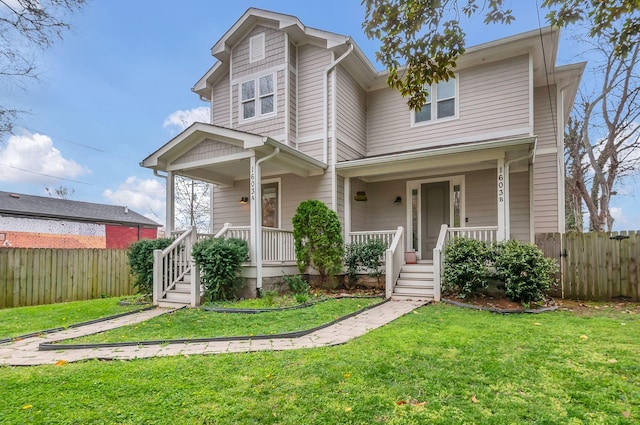 1603A 9th Ave N, Nashville, TN 37208 - view of front of home with a front yard, covered porch, and fence