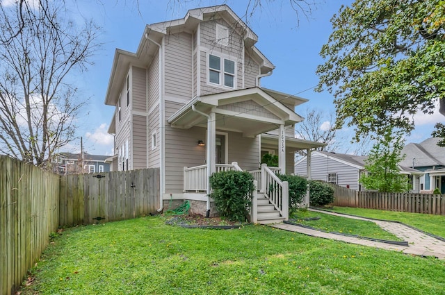 1603A 9th Ave N, Nashville, TN 37208 - view of front of property featuring covered porch, a front lawn, and a fenced backyard
