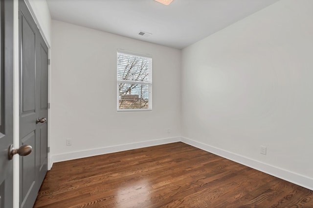 1603A 9th Ave N, Nashville, TN 37208 - unfurnished bedroom featuring visible vents, baseboards, and dark wood finished floors