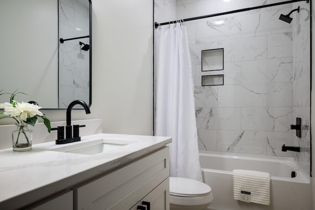 full bathroom featuring toilet, vanity, and shower / bath combo with shower curtain