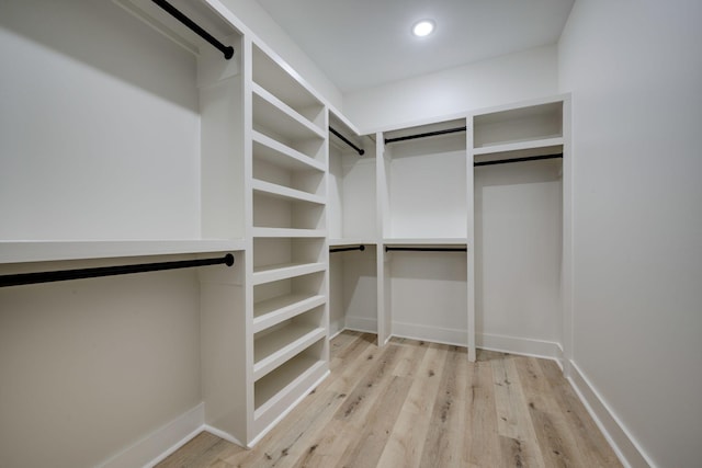 spacious closet featuring wood finished floors