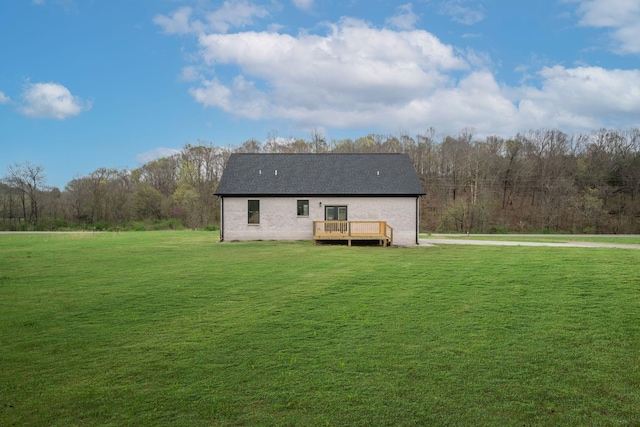 back of house with a lawn and a wooden deck