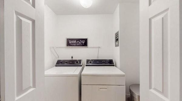 washroom with separate washer and dryer
