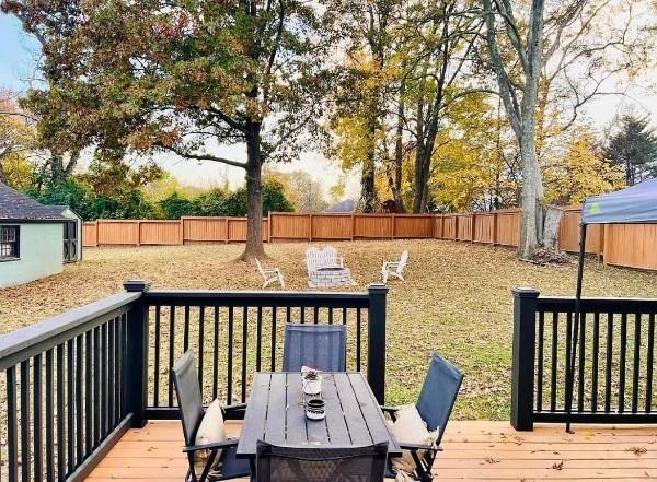 wooden deck featuring a fenced backyard and outdoor dining area