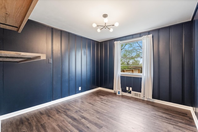 212 S Sequoia Dr, Springfield, TN 37172 - spare room with baseboards, wood finished floors, and a notable chandelier