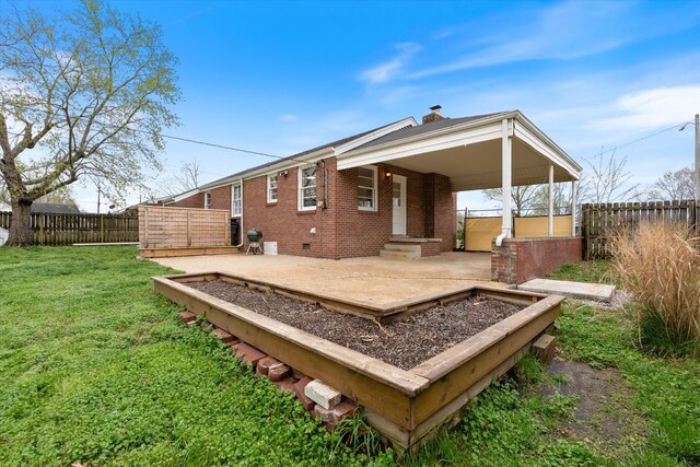 212 S Sequoia Dr, Springfield, TN 37172 - back of house with a lawn, brick siding, a chimney, and a fenced backyard