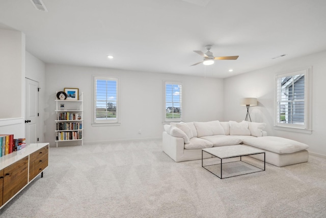 living room featuring recessed lighting, light carpet, ceiling fan, and visible vents