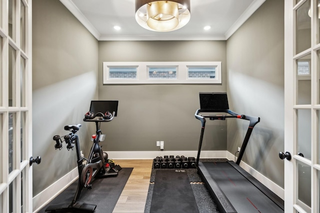 exercise room with baseboards, ornamental molding, wood finished floors, recessed lighting, and french doors
