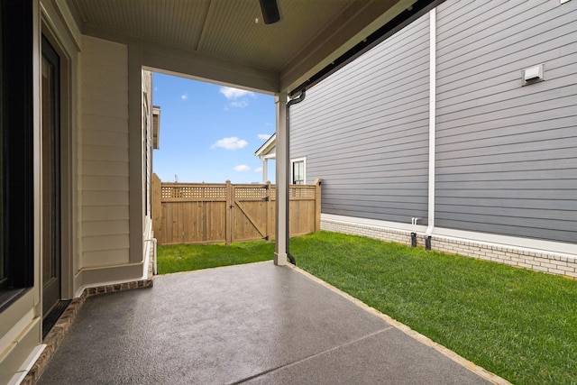 view of patio / terrace featuring a gate, fence, and a ceiling fan