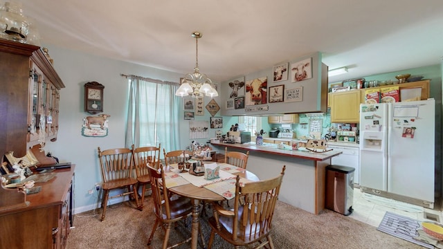dining space with a wealth of natural light, a chandelier, and light carpet