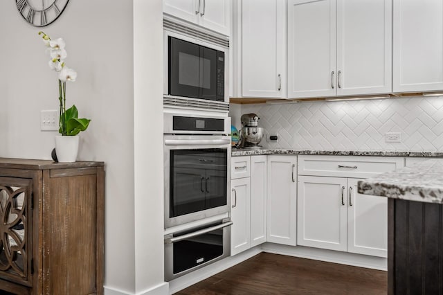 1701 Glen Echo Rd, Nashville, TN 37215 - kitchen with light stone countertops, black microwave, and stainless steel oven