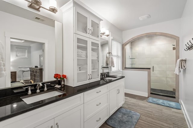 1701 Glen Echo Rd, Nashville, TN 37215 - full bath with visible vents, a sink, a walk in shower, and double vanity
