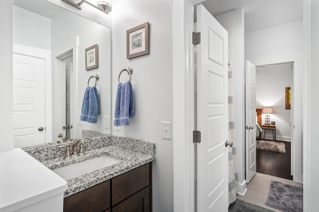 1701 Glen Echo Rd, Nashville, TN 37215 - full bath featuring baseboards, wood finished floors, and vanity