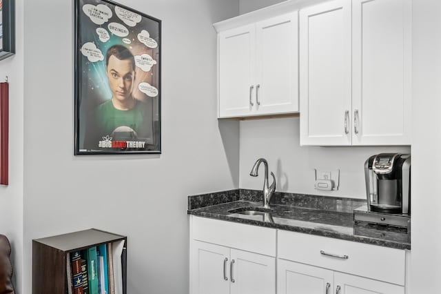 1701 Glen Echo Rd, Nashville, TN 37215 - kitchen with white cabinets, a sink, and dark stone counters