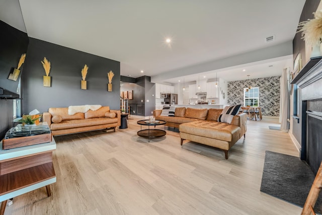 17 Kilkham Ct, Mount Juliet, TN 37122 - living area with light wood-style flooring, wallpapered walls, baseboards, and visible vents