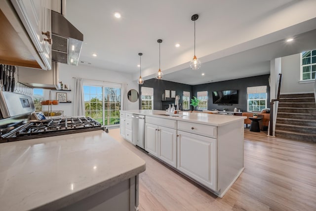 17 Kilkham Ct, Mount Juliet, TN 37122 - kitchen with white cabinets, gas stove, dishwasher, a sink, and light wood finished floors
