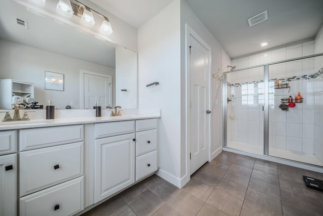 17 Kilkham Ct, Mount Juliet, TN 37122 - bathroom with double vanity, visible vents, a sink, and a stall shower