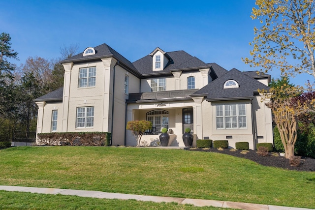 9812 Windrose Cir, Chattanooga, TN 37421 - view of front of property with a balcony, a front yard, covered porch, and stucco siding