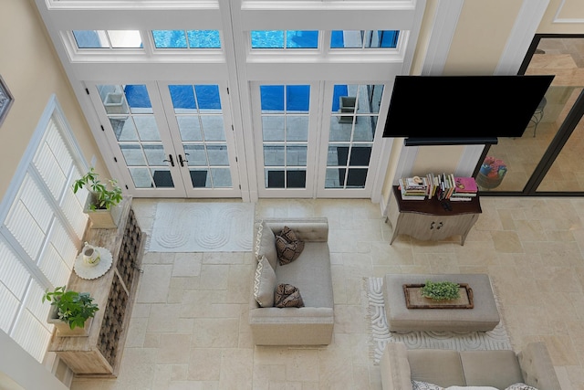 9812 Windrose Cir, Chattanooga, TN 37421 - living room featuring french doors and stone tile floors