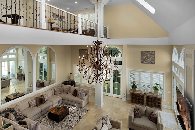 9812 Windrose Cir, Chattanooga, TN 37421 - living room featuring an inviting chandelier, a towering ceiling, and baseboards