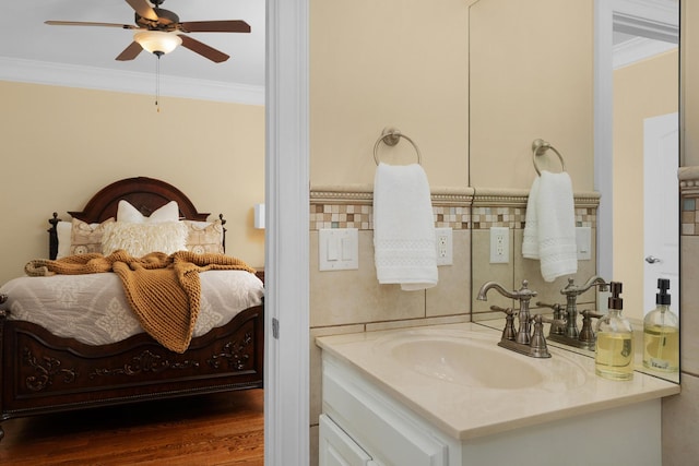 9812 Windrose Cir, Chattanooga, TN 37421 - bathroom featuring vanity, ornamental molding, connected bathroom, ceiling fan, and wood finished floors