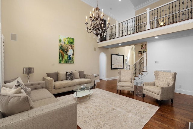 9812 Windrose Cir, Chattanooga, TN 37421 - living area with dark wood-style flooring, stairs, ornamental molding, a towering ceiling, and arched walkways