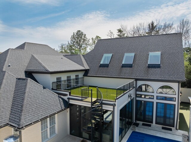 9812 Windrose Cir, Chattanooga, TN 37421 - rear view of house featuring stucco siding, a shingled roof, and stairway
