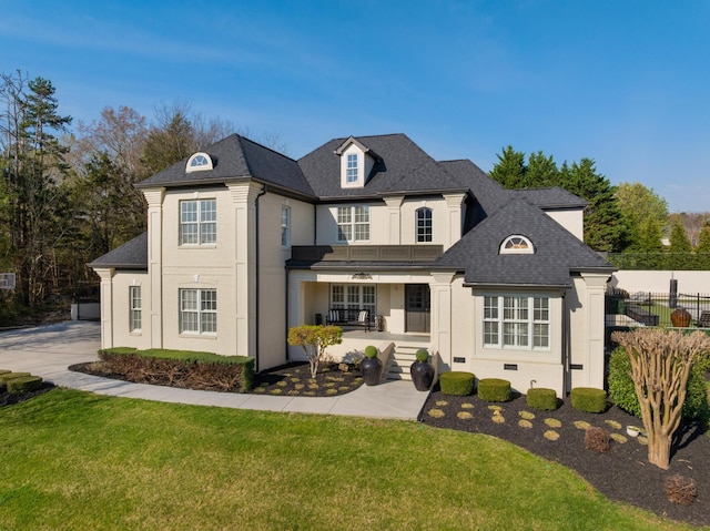 9812 Windrose Cir, Chattanooga, TN 37421 - french provincial home with driveway, stucco siding, fence, a balcony, and a front lawn