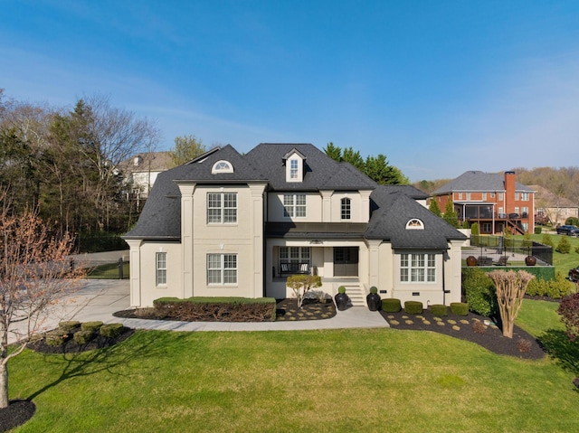9812 Windrose Cir, Chattanooga, TN 37421 - back of house featuring stucco siding, roof with shingles, and a yard